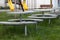 Row of empty outdoor tables and benches