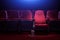 Row of empty red cinema seats