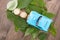 A row of euro coins surrounded by fresh green leaves and cars climbing on them