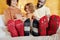 Row of feet of young family of three wearing warm woolen socks