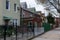 Row of Fenced In Old Brick and Wood Homes in Astoria Queens New York