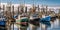 A row of fishing boats docked at a bustling harbor, contrasted against a lively maritime backdrop, concept of Marine