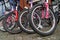 Row of front wheels on child bicycles