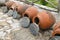 Row of Georgian traditional wine making clay vessels kvevri