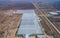 Row of glass greenhouses for vegetable production. aerial photo