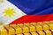 Row of gold bars on the Philippines flag background. Concept of gold reserve and gold fund of Philippines