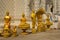 Row of golden buddha statue in Wat Mai Kham Wan temple, Phichit,Thailand.