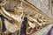 Row of golden Garuda are beautifully decorated on the walls of the Emerald Buddha temple in Grand Palace