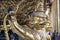 Row of golden Garuda are beautifully decorated on the walls of the Emerald Buddha temple in Grand Palace