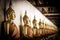 Row of golden meditation buddha sitting figures statues inside corridor is lined up at Wat Phutthaisawan, Phra Nakhon Si Ayutthay