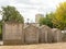 Row of grave tombs with apartment building behind in Alto de Sao Joao cemtery, Lisbon