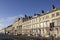 Row of guesthouses and hotels in sunlight along the Esplanade promenade, Weymouth,