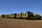 Row of heavy duty Caterpillar tractors