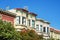 Row of historic houses in the downtown districts of San Francisco California in late afternoon sun with clear blue sky