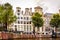 Row of historic houses with ornate Bell and Neck Gables along the Herengracht Gentlemens Canal in Amsterdam