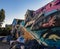 Row of Homeless tents alongside a Mural in Venice Beach, California