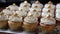 A row of homemade cupcakes, a sweet celebration of indulgence generated by AI