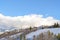 Row of homes on pristine snowy slope with unobstructed view of Wasatch Mountains