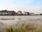 Row of houses coast marina dock other side of river