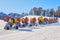Row of idle snow guns cannons branded Latemar, from TechnoAlpin, lined up on a ski slope in Val di Fassa domain, Dolomites.