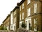 A row of imposing period Victorian stone built semi detached houses in north London UK.