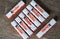 Row of Kinder chocolate bars on wooden background