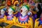 A row of laughing clown faces