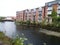 A row of living houses on a river in Cork.