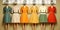 A row of mannequins wearing different colored dresses. Generative AI image. Visualization of gender spectrum