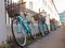 Row of matching rental student bicycles with baskets