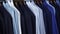 Row of men suit jackets and shirts on hangers