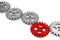 Row of metal cogwheel gears with a central red wheel over white background, teamwork, connection or communiaction abstract concept