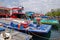 A row of modern large fishing vessel boat boats docking along Boduthakurufaanu Magu nearby the fish market at Male Maldives