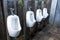 Row of Modern men urinals toilet background