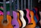 Row of multi-colored Mexican guitars