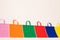 Row of multi colour canvas bags with copy space on white background