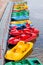 Row of multicolored catamarans on a mooring