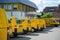 Row of multiple electric Volkswagen yellow vans with Deutsche post DHL logotype