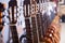 Row of new acoustic guitars in music shop