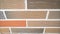 Row of new detached houses. Brickwork of the facade of the house made of colored brick. Colored brick house