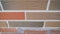 Row of new detached houses. Brickwork of the facade of the house made of colored brick. Colored brick house