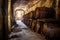 row of old barrels in a rustic cellar