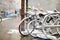 Row of old bicycles covered with snow after massive snowfall in New York City at wintertime.