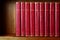 Row of Old Books on Shelf