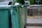 Row of old green trash bin in the community