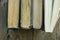 Row of old and new books, top view of spine, weathered wood background, education, school, learning concept