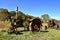 Row of old rusty tractors