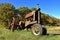 Row of old rusty tractors