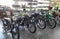 A row of old vintage motorcycles stands in a shop after restoration