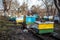 row of old yellow and blue hives on old apiary. large apiary to remove bee uteruses on point. Preparing bees for wintering